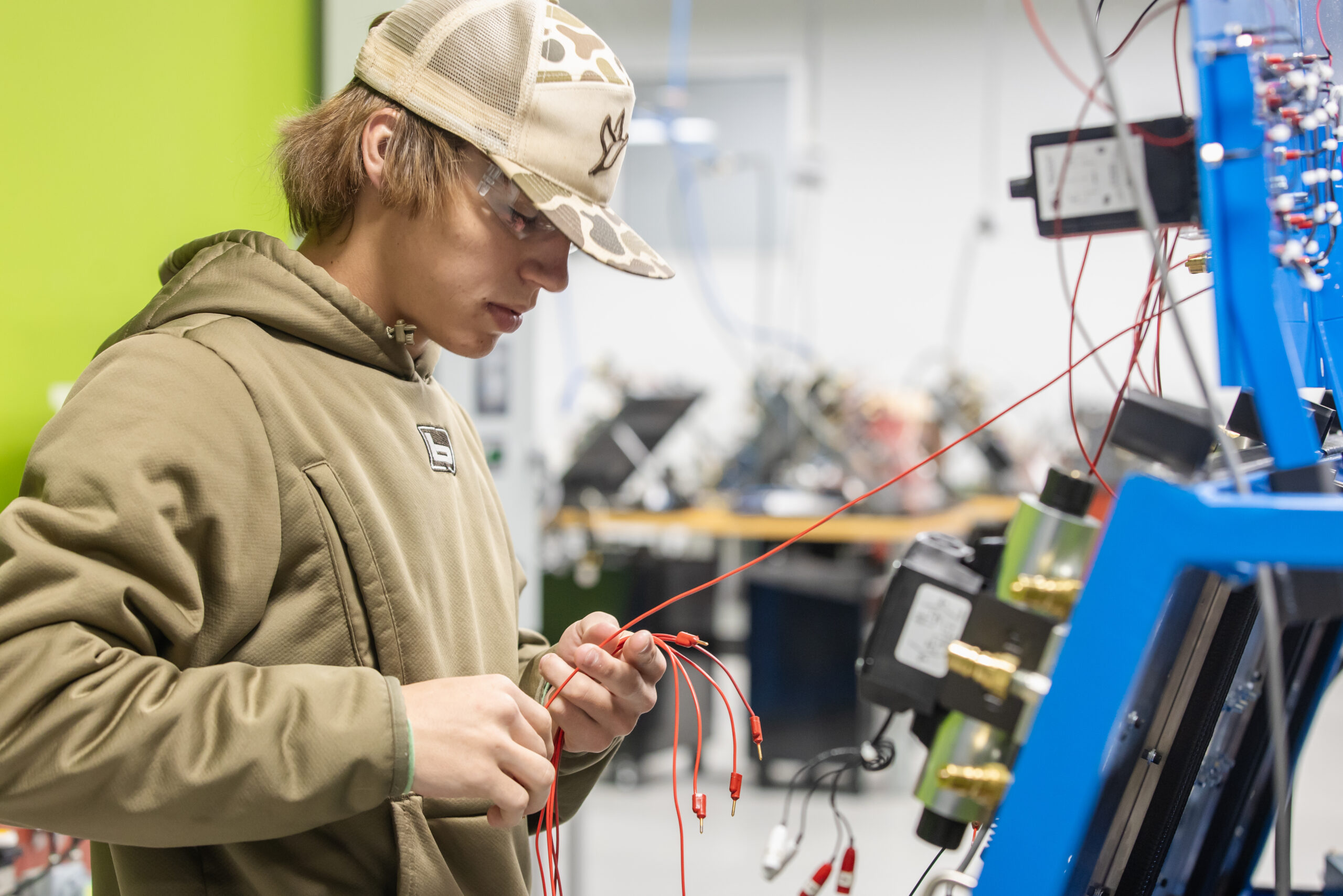 Student working on a machine in mechatronics class